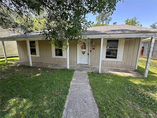 2216 Teal St, Slidell, LA 70460 - bungalow featuring a front lawn and covered porch