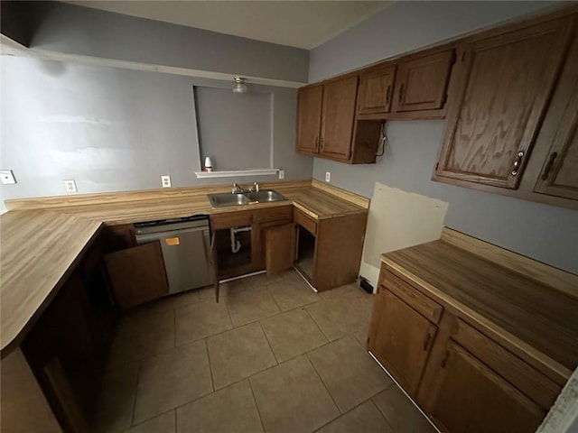 2216 Teal St, Slidell, LA 70460 - kitchen with dishwasher, a sink, light tile patterned floors, brown cabinetry, and light countertops