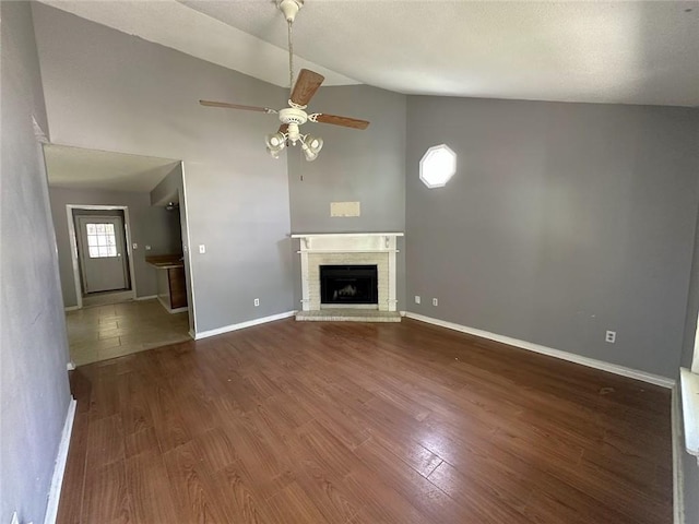 2216 Teal St, Slidell, LA 70460 - unfurnished living room with a ceiling fan, high vaulted ceiling, wood finished floors, and baseboards