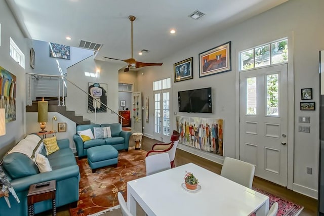 1126 Toledano St, New Orleans, LA 70115 - living area with stairs, wood finished floors, recessed lighting, a ceiling fan, and baseboards