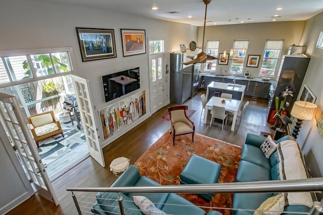 1126 Toledano St, New Orleans, LA 70115 - living area with healthy amount of natural light, wood finished floors, and recessed lighting