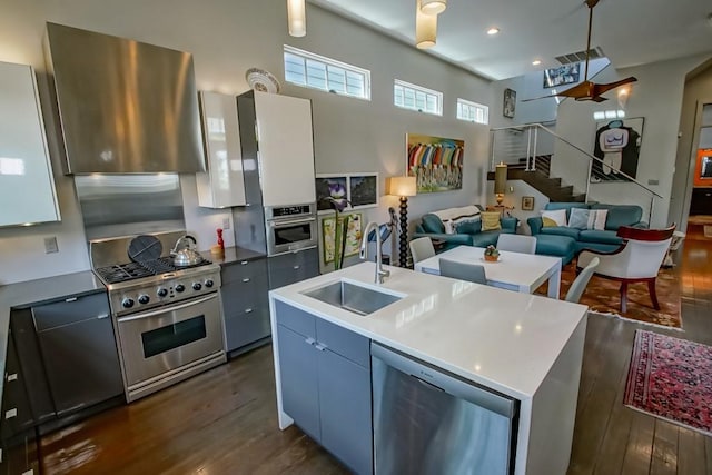 1126 Toledano St, New Orleans, LA 70115 - kitchen with a sink, stainless steel appliances, dark wood-style floors, open floor plan, and modern cabinets