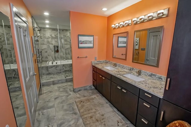 1126 Toledano St, New Orleans, LA 70115 - bathroom with double vanity, tiled shower, a tub with marble appearance, and recessed lighting