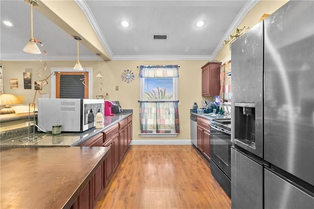 7542 Lehigh St, New Orleans, LA 70127 - kitchen with stainless steel appliances, ornamental molding, light wood-type flooring, baseboards, and decorative light fixtures