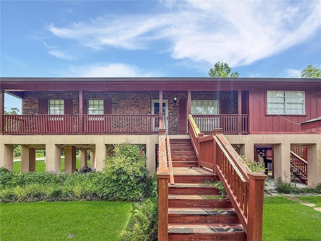 34159 Tupelo Ln, Slidell, LA 70460 - view of front of house featuring stairs, a front lawn, and board and batten siding