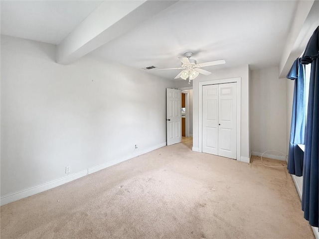 34159 Tupelo Ln, Slidell, LA 70460 - unfurnished bedroom featuring light carpet, a closet, baseboards, and ceiling fan