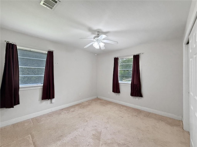 34159 Tupelo Ln, Slidell, LA 70460 - spare room featuring a ceiling fan, carpet, and baseboards