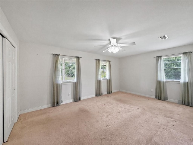 34159 Tupelo Ln, Slidell, LA 70460 - unfurnished bedroom featuring multiple windows, carpet, and baseboards