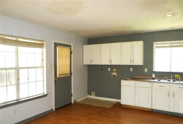 70305 I St, Covington, LA 70433 - laundry area with washer hookup, cabinet space, wood finished floors, baseboards, and hookup for a gas dryer