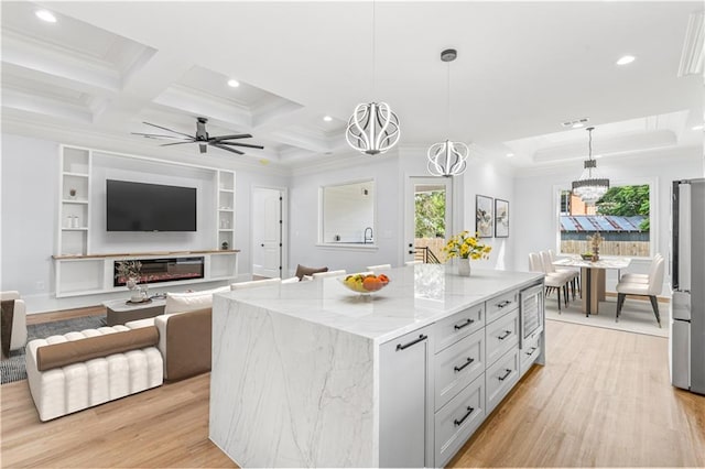 8925 25th St, Metairie, LA 70003 - kitchen featuring plenty of natural light, recessed lighting, light stone counters, light wood-type flooring, and crown molding