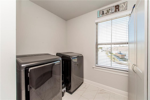 2329 Bradbury Pl, Covington, LA 70433 - laundry room with washer and clothes dryer and light marble finish flooring