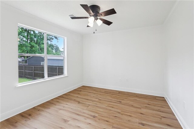 625 Woodridge Blvd, Mandeville, LA 70471 - empty room featuring light wood finished floors, baseboards, crown molding, and a ceiling fan