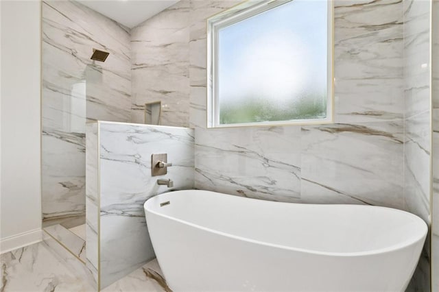 7211 Claiborne Ct, Arabi, LA 70032 - full bath with marble tiled floors, a marble finish shower, a freestanding tub, and tile walls