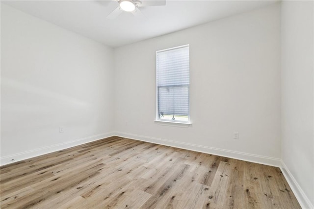 7211 Claiborne Ct, Arabi, LA 70032 - unfurnished room featuring a ceiling fan, wood finished floors, and baseboards