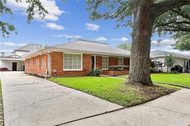 547 Jewel St, New Orleans, LA 70124 - ranch-style home with driveway, brick siding, and a front lawn
