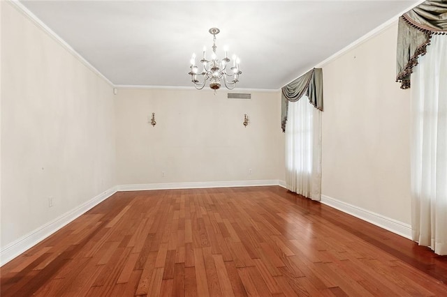 547 Jewel St, New Orleans, LA 70124 - empty room featuring a chandelier, ornamental molding, wood finished floors, and baseboards