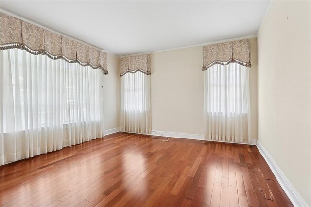 547 Jewel St, New Orleans, LA 70124 - empty room featuring hardwood / wood-style flooring, baseboards, and ornamental molding
