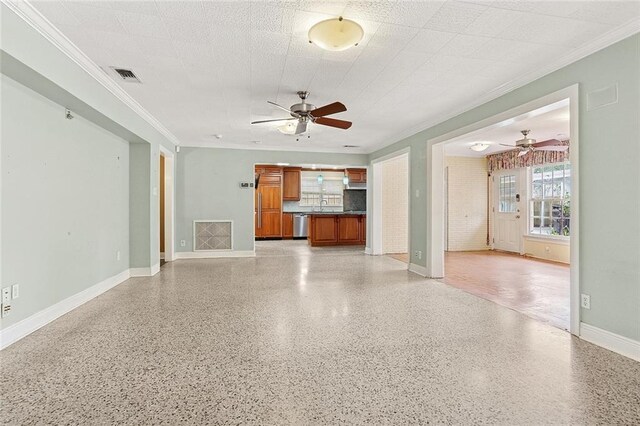 547 Jewel St, New Orleans, LA 70124 - unfurnished living room featuring ceiling fan, baseboards, crown molding, a sink, and dark speckled floor