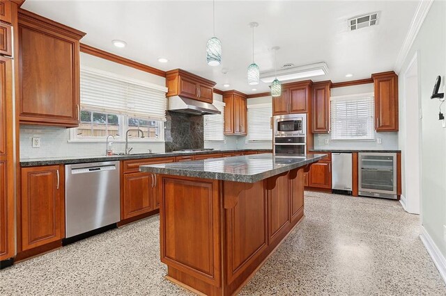 547 Jewel St, New Orleans, LA 70124 - kitchen with appliances with stainless steel finishes, wine cooler, extractor fan, a kitchen island, and backsplash