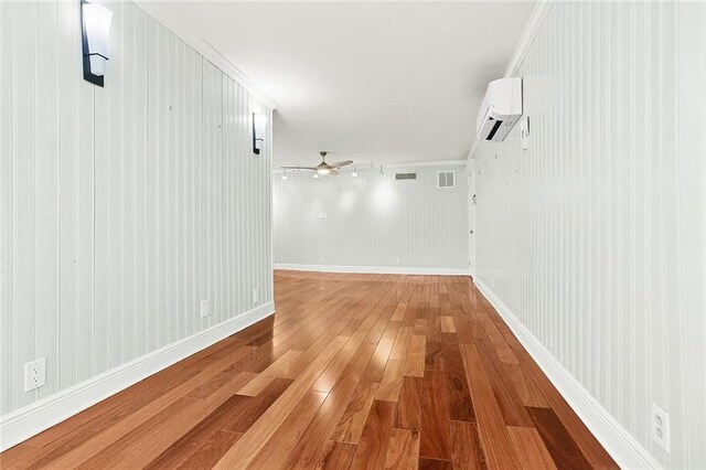 547 Jewel St, New Orleans, LA 70124 - hall featuring an AC wall unit and light wood-type flooring