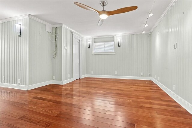 547 Jewel St, New Orleans, LA 70124 - below grade area with hardwood / wood-style floors, ceiling fan, crown molding, and baseboards