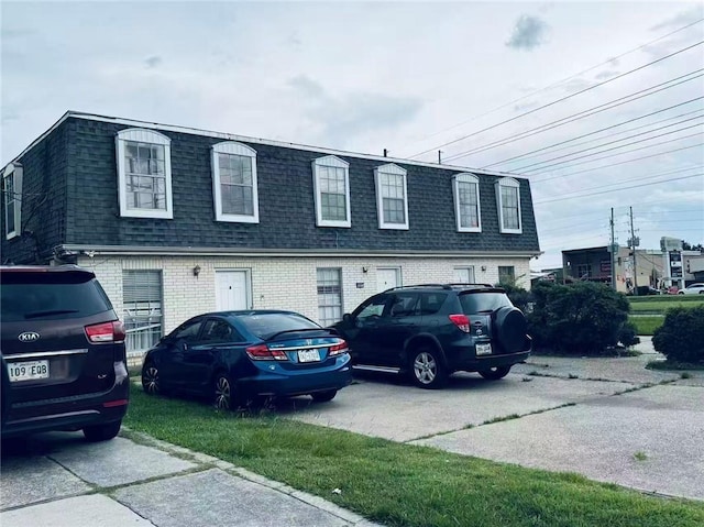 4401 Lefkoe St, Metairie, LA 70006 - view of front of home with mansard roof, roof with shingles, and brick siding