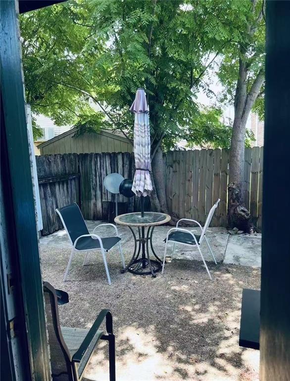 4401 Lefkoe St, Metairie, LA 70006 - fenced backyard with a patio area