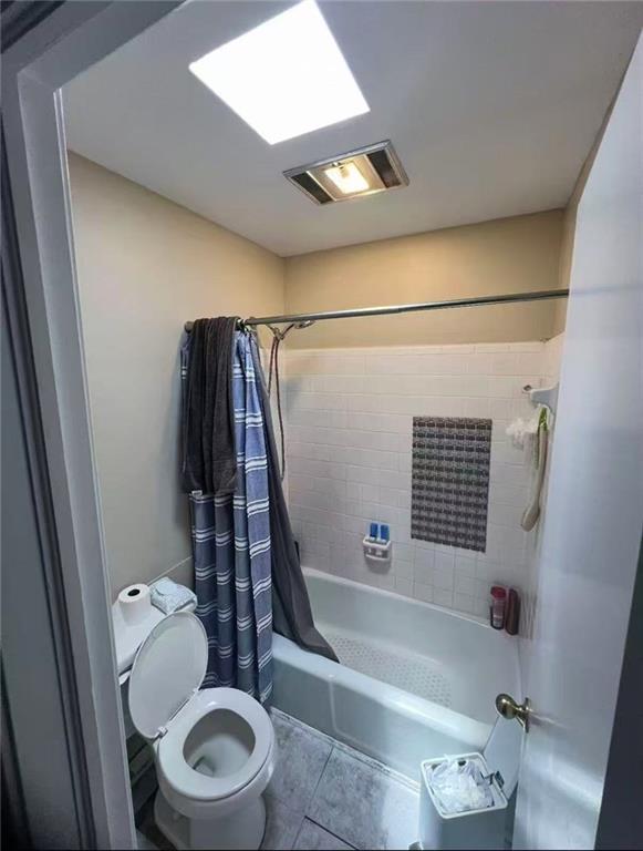 4401 Lefkoe St, Metairie, LA 70006 - full bath with toilet, shower / tub combo with curtain, and tile patterned flooring