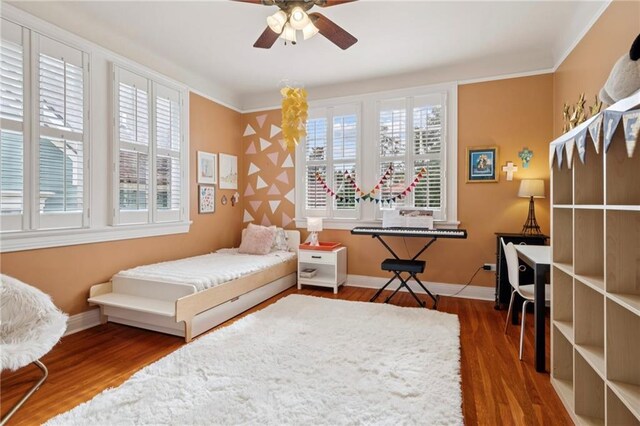 5930 Memphis St, New Orleans, LA 70124 - bedroom featuring wood finished floors, baseboards, and ceiling fan