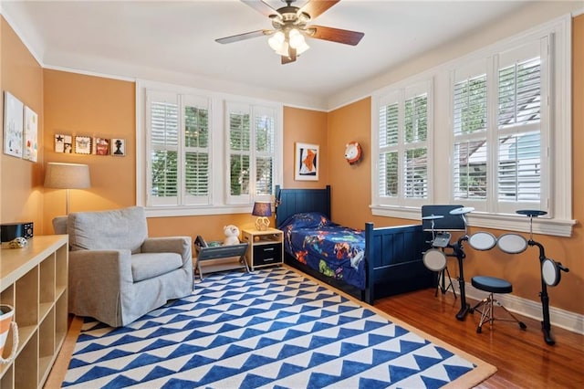 5930 Memphis St, New Orleans, LA 70124 - bedroom featuring multiple windows, wood finished floors, baseboards, and a ceiling fan
