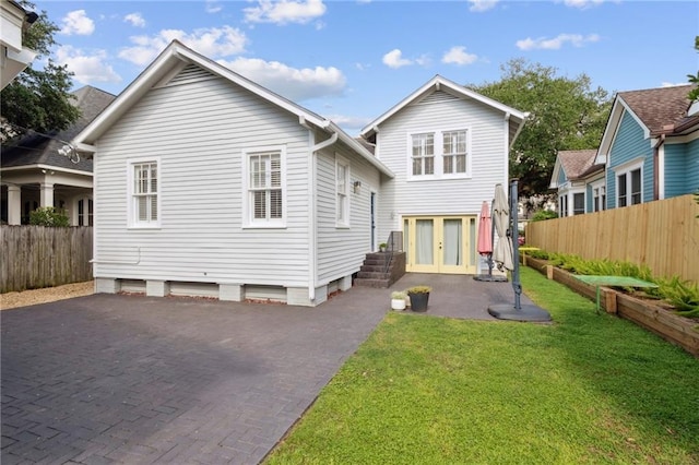 5930 Memphis St, New Orleans, LA 70124 - rear view of property with french doors and a patio