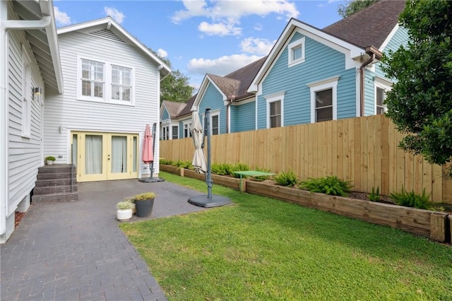 5930 Memphis St, New Orleans, LA 70124 - view of yard with french doors and a patio area