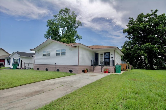 213 Travis Dr, Westwego, LA 70094 - ranch-style home with a front lawn and driveway