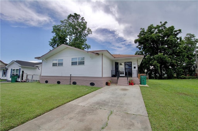 213 Travis Dr, Westwego, LA 70094 - ranch-style home with a front lawn and driveway