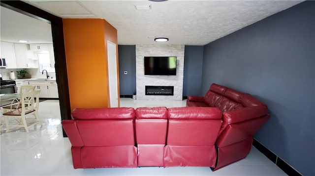 213 Travis Dr, Westwego, LA 70094 - living room featuring a fireplace and a textured ceiling
