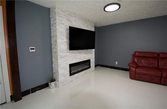 213 Travis Dr, Westwego, LA 70094 - unfurnished living room with a textured ceiling and a stone fireplace