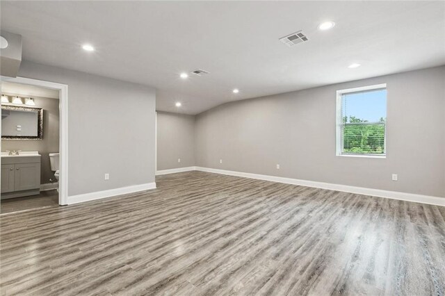 1400 Woodland Hwy, Belle Chasse, LA 70037 - basement with wood finished floors, baseboards, a sink, and recessed lighting