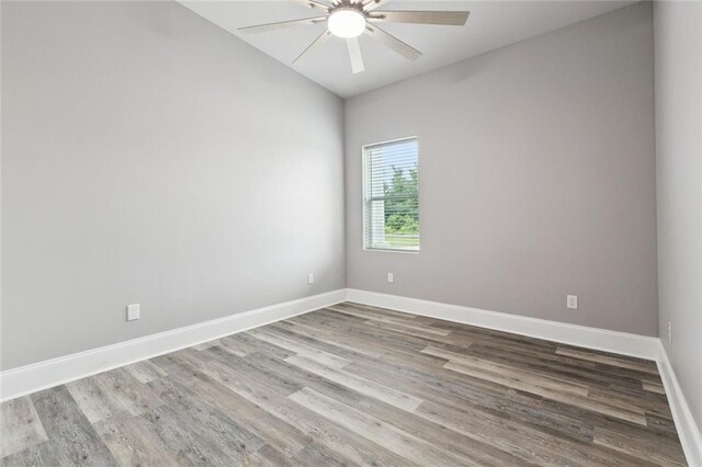 1400 Woodland Hwy, Belle Chasse, LA 70037 - unfurnished room with a ceiling fan, lofted ceiling, wood finished floors, and baseboards