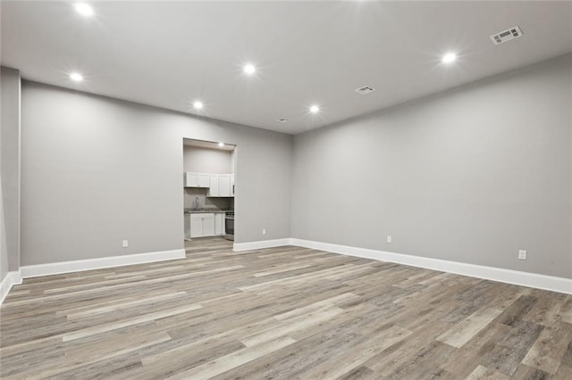 1400 Woodland Hwy, Belle Chasse, LA 70037 - unfurnished room with recessed lighting, baseboards, and light wood-style flooring