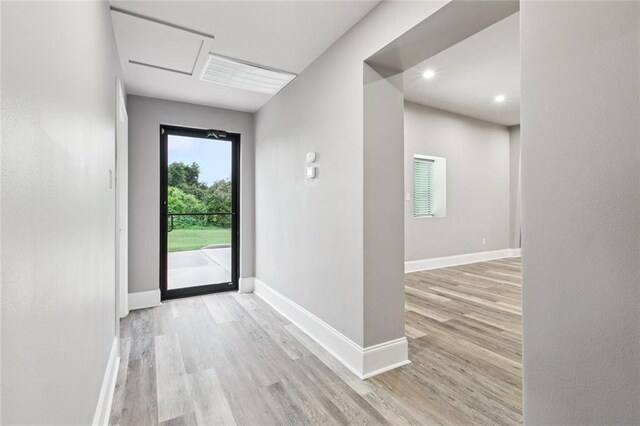 1400 Woodland Hwy, Belle Chasse, LA 70037 - doorway featuring wood finished floors, baseboards, and recessed lighting