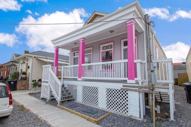 2754 Saint Ann St, New Orleans, LA 70119 - shotgun-style home featuring covered porch