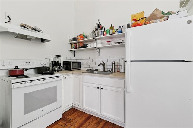 2754 Saint Ann St, New Orleans, LA 70119 - kitchen featuring white appliances, open shelves, light countertops, and dark wood finished floors