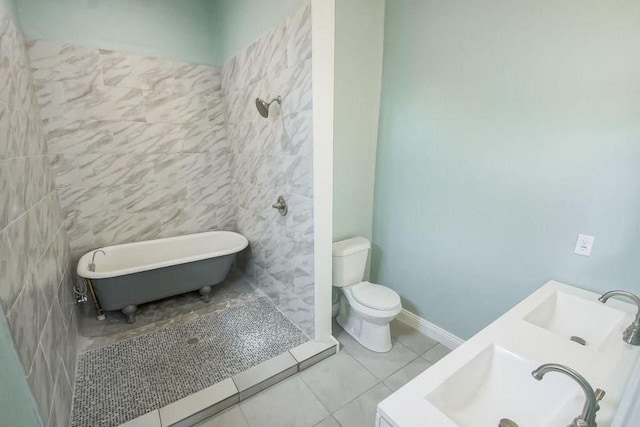 2754 Saint Ann St, New Orleans, LA 70119 - bathroom featuring a soaking tub, tile patterned floors, and double vanity
