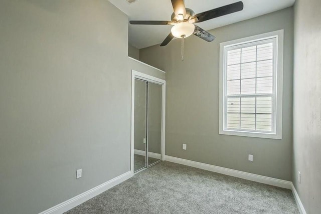 2754 Saint Ann St, New Orleans, LA 70119 - unfurnished bedroom with carpet, a closet, and a ceiling fan