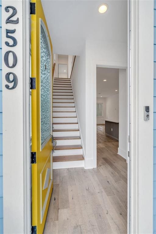2509 Palmyra St, New Orleans, LA 70119 - foyer entrance with wood finished floors, stairway, and recessed lighting