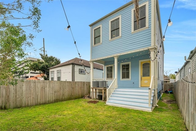 2509 Palmyra St, New Orleans, LA 70119 - back of property with covered porch and a fenced backyard