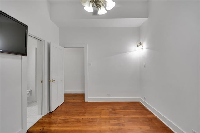 526 Madison St Unit 1B, New Orleans, LA 70116 - unfurnished bedroom with light wood-type flooring and baseboards