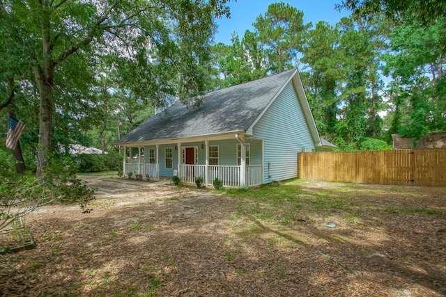 70380 K St, Covington, LA 70433 - view of front facade with a porch and a shingled roof