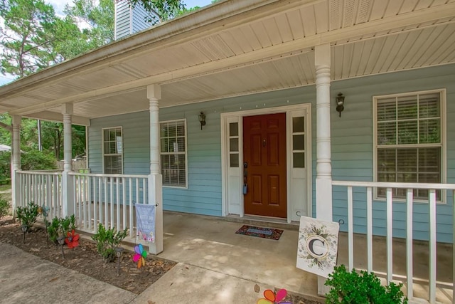 70380 K St, Covington, LA 70433 - property entrance featuring covered porch and a chimney