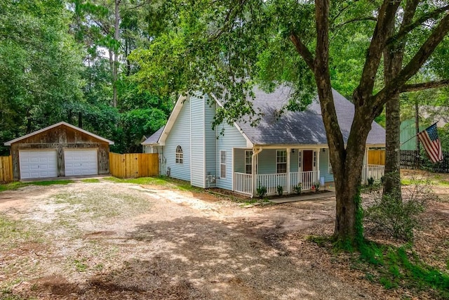 70380 K St, Covington, LA 70433 - view of front of home with a porch, a garage, and a shingled roof
